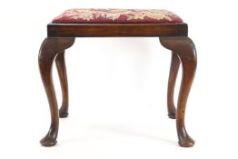 An 18th century style mahogany dressing table stool with drop in tapestry seat