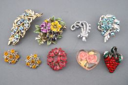 A collection of costume jewellery brooches of variable designs.