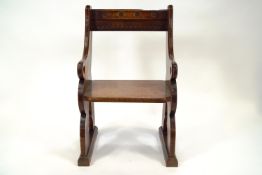 A 19th century oak Priest's sanctuary chair in the Gothic style, of boxed rectangular form,