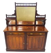 A Victorian mahogany sideboard with raised mirrored back above two drawers above two panelled doors