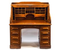 An early 20th century oak roll top Derby desk,