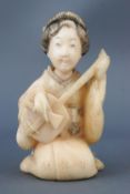 A 19th century Japanese carved and stained ivory Okimono of a kneeling lady playing a shamisen