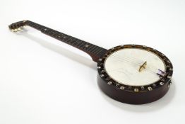 A cased American left handed banjo and case