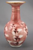 A studio vase by Marianne de Trey, in porcelain, of baluster form, decorated in pinks,