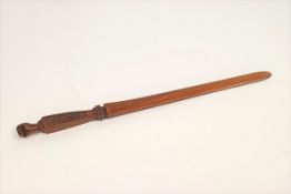A Royal flying Corps carved mahogany letter opener, with a clenched hand finial,