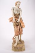 A Royal Dux female figure of a lady harvesting corn, with a sickle and a sheaf in her arms,