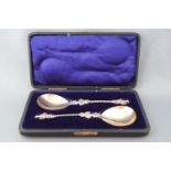 A pair of cased silver Apostle serving spoons with a 3D cast terminal figure of St James
