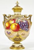 A large Royal Worcester 1691 pattern hand painted fruit pedestal vase and cover with twin handles