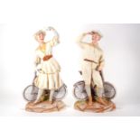 A pair of Heubach coloured decorated bisque cycling figures of a gentleman and a lady,