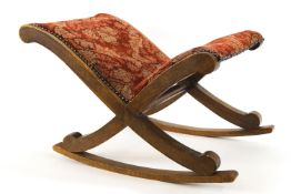 A 19th century mahogany footstool/rocker of saltire form,