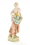 A Royal Dux figure of a female carrying corn, applied pink triangle acorn mark,