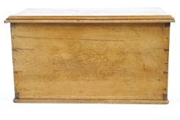 A pine blanket box with indistinct relief decoration to lid and front,