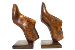 A pair of cobblers shoe patterns, mounted as book ends,
