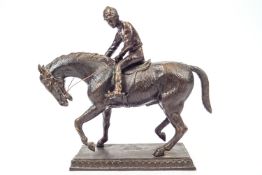 A bronze horse and jockey figure, 'Preparing for the Off',