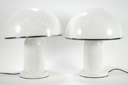 A pair of cylindrical table lamps with white acrylic hemispherical shades,