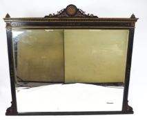 An ebonised over mantel of large rectangular proportions and highlighted with gilt detailing,