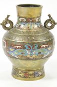 A Japanese brass two handled vase, decorated with three champleve bands,