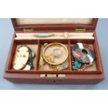 A jewellery case consisting of multiple items of costume jewellery and watches,