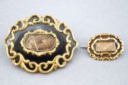 A collection of two Georgian mourning brooches.