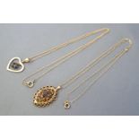 A hallmarked 9ct gold garnet cluster pendant with chain together with a 9ct gold heart pendant