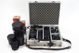 A Canon ES camera with 500mm reflex lens, 100-300mm zoom lens, 50mm lens, 24mm lens etc