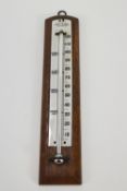 A Negretta and Zambra thermometer with enamel back plate inset into mahogany frame,