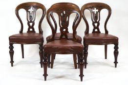 A set of seven Victorian balloon back dining chairs with pierced and carved splats,