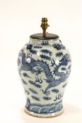 A Chinese porcelain vase, painted in underglaze blue with dragons chasing the flaming pearl,