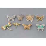 A collection of twenty costume brooches of butterfly, dragonfly and bumble bee design.