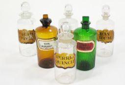 Six Chemist dispensary bottles with stoppers : A ribbed green glass chemist's bottle,