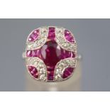 A white metal dress ring, set with an oval faceted cut ruby of approximately 1.30cts.