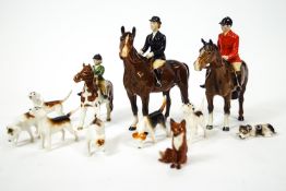 A Beswick china hunting group, comprising three riders, five hounds and the fox...