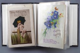A postcard album to include seven 1st WW silks and other greetings