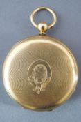 A yellow metal full hunter pocket watch. White dial with roman numerals.