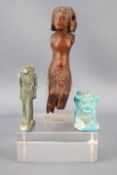 An Egyptian wood figure, mounted on a perspex stand, 10cm high,