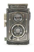 A Rolleicord Compar twin lens Reylex camera with leather case