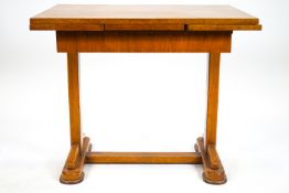 A Retro kitchen table, the two draw leaf top quarter veneered in oak over a frieze ,
