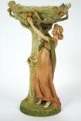 A Royal Dux porcelain centre piece in the form of a lady picking fruit from a tree,