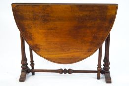 A mahogany Sutherland table of traditional oval form,