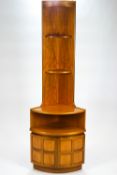 A teak Nathan corner unit, base cupboard with three shelves above,