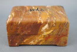 A carved hardstone chop box, the lift off lid decorated with a character mark,