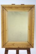 A pair of rectangular pine framed wall mirrors,