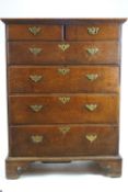 A George III oak lowboy of two short and four long drawers with matching brass handles