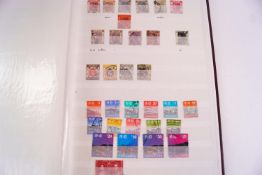 Hong Kong stamps, in a stock book with other associated material,