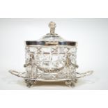 A cut glass biscuit barrel with silver plated hinged cover, on silver plated two handled stand,