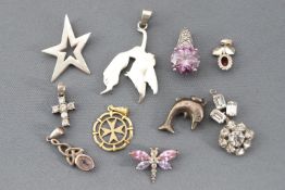 A collection of ten pendants of variable designs and mixed metals,