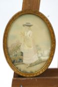 A late 18th century silk work picture of a lady in a landscape, in later oval frame, 26cm x 20.