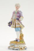 A French bisque figure of a gentleman holding grapes, 36cm high, impressed VG to base,