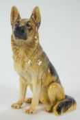 A Beswick pottery figure of an alsatian, impressed factory marks, numbered 2410,