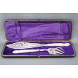 A cased set of plated fish servers with pierced and engraved blades on engine turned bead edge